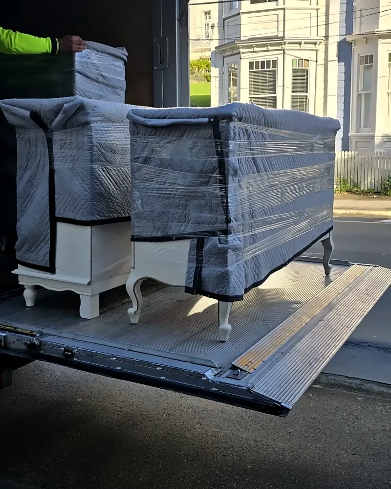 Wrapped furniture on the truck tail-lift during a Wellington move